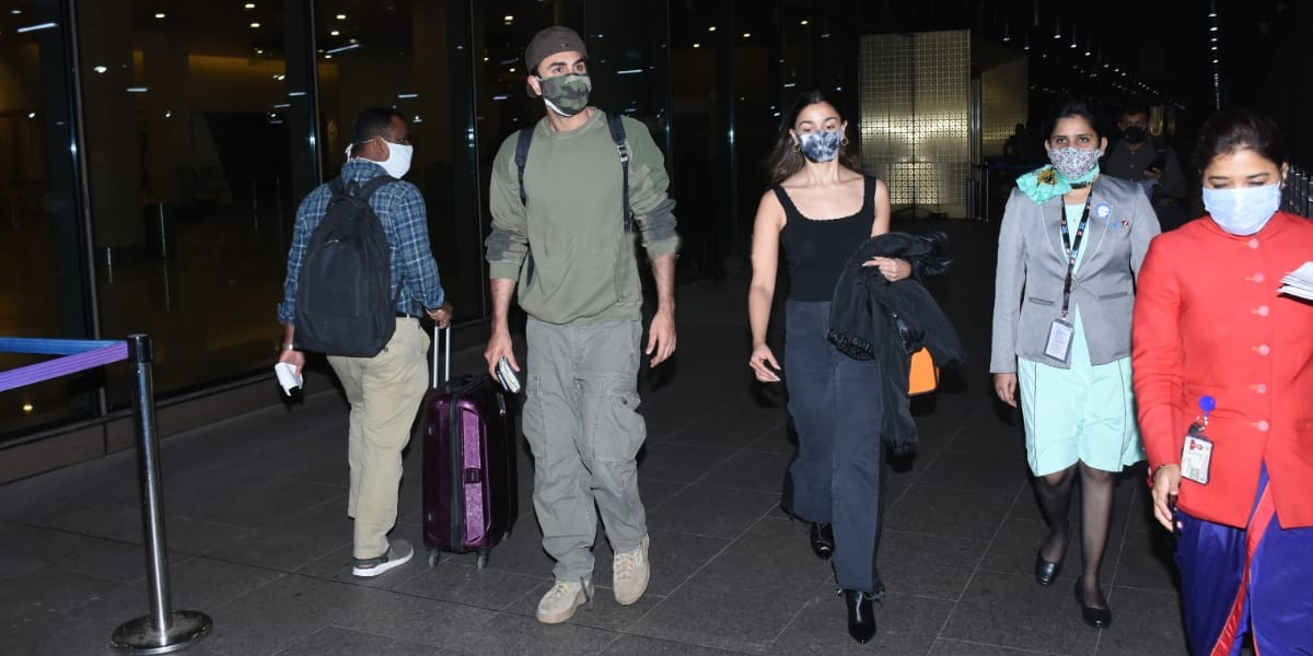 Alia Bhatt and Ranbir Kapoor make for a perfect couple as they arrive back in Mumbai from New Year trip; PICS